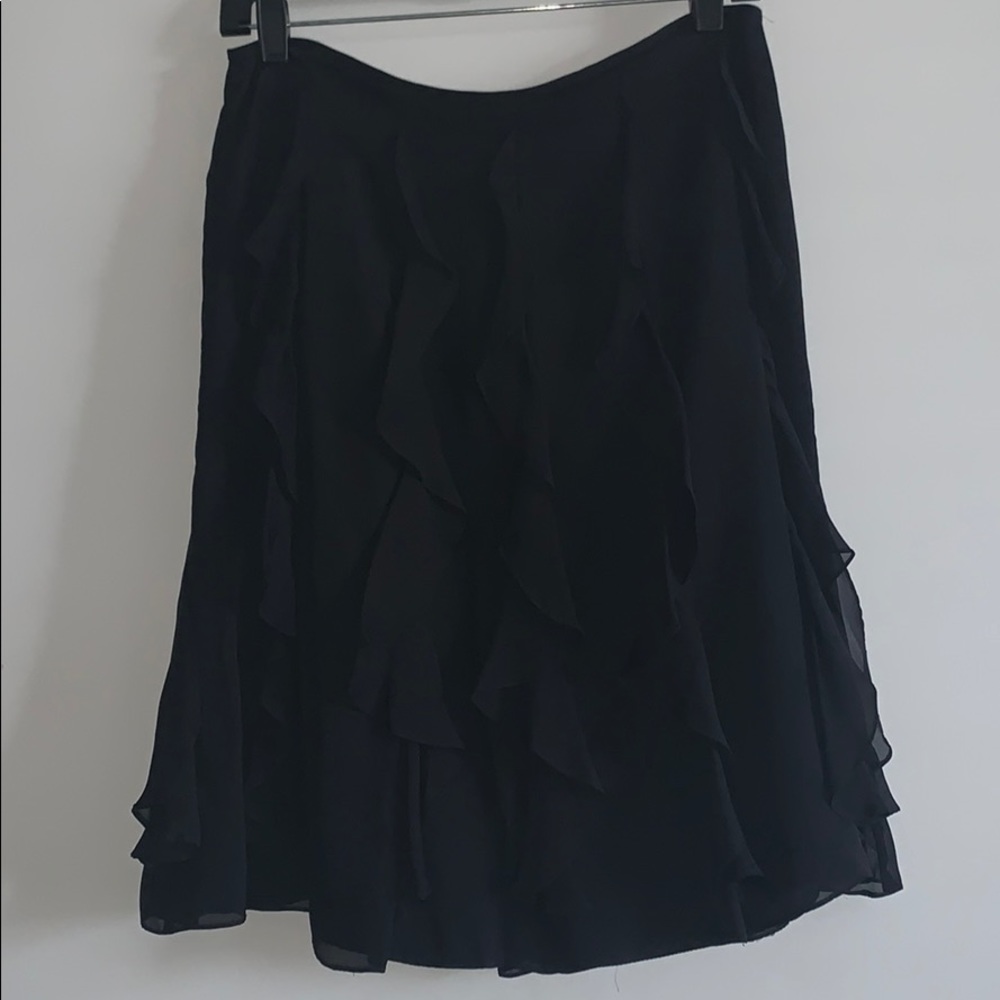 Black silk skirt with ruffle detail.